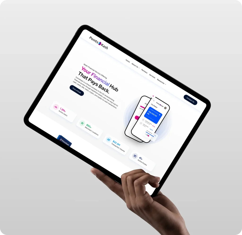 A hand holding a tablet showing the PointsKash fintech website