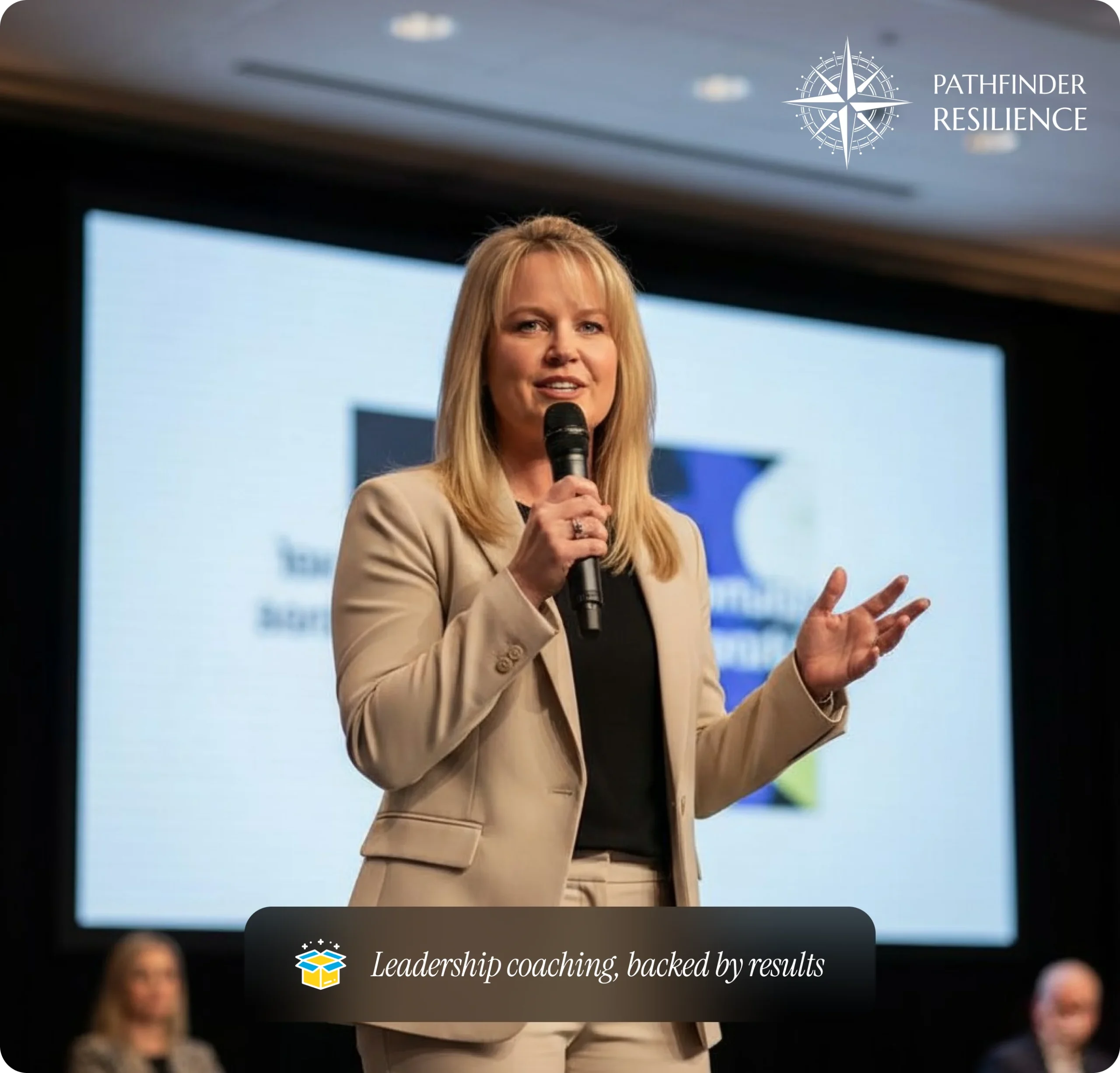 Dr. Renee Thornton speaking into a microphone on stage