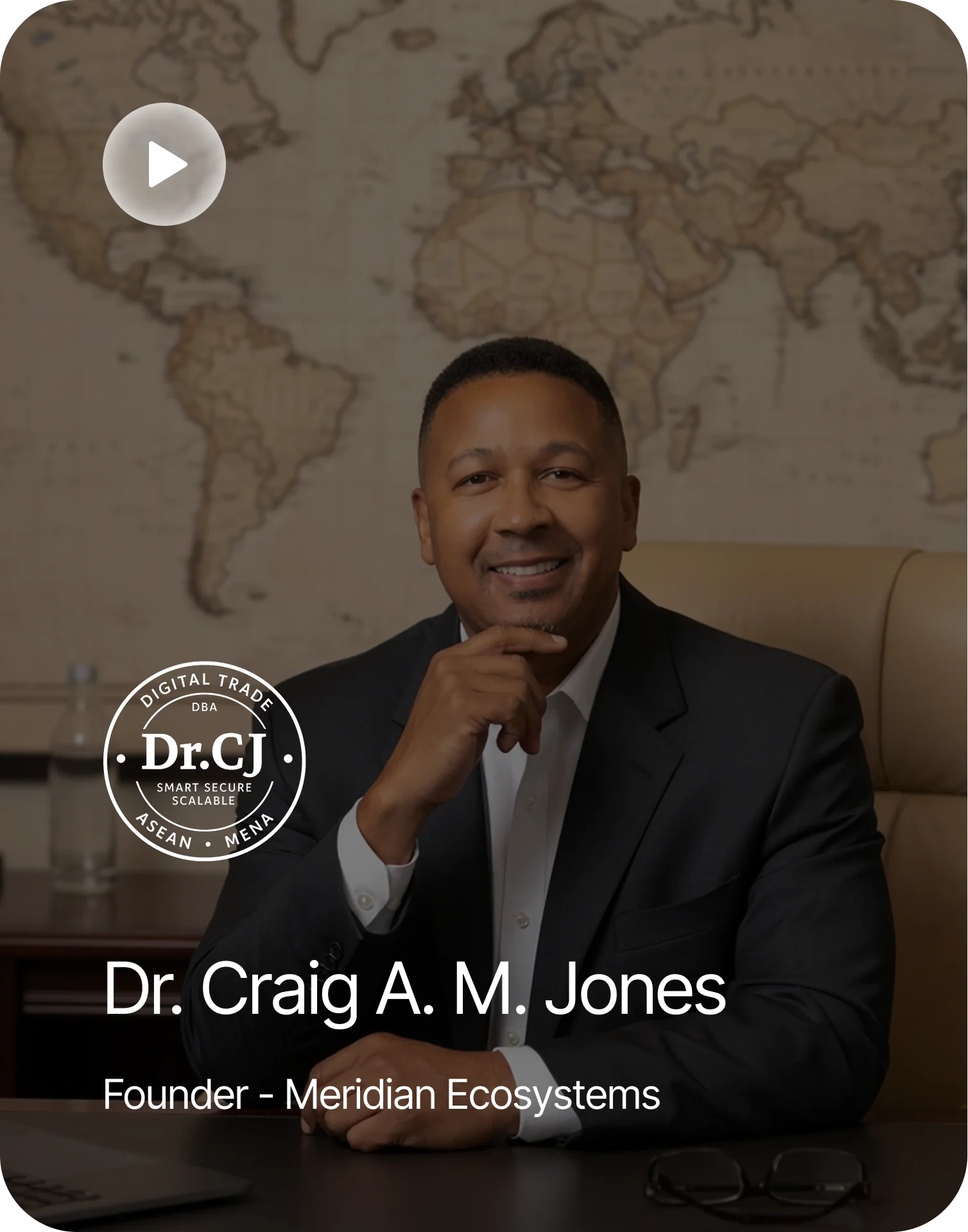 Dr. Craig A. M. Jones, founder of Meridian Ecosystems, at a desk in front of a world map