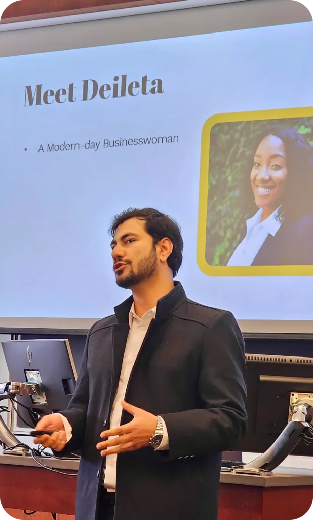 A man presenting in front of a slide titled Meet Deileta