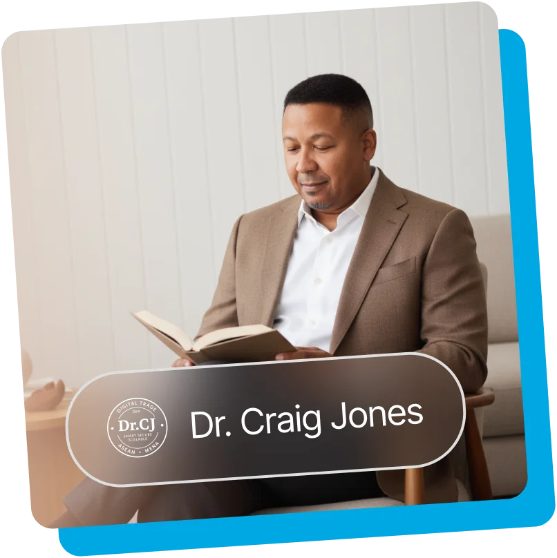 Dr. Craig Jones reading a book, in a tan suit jacket