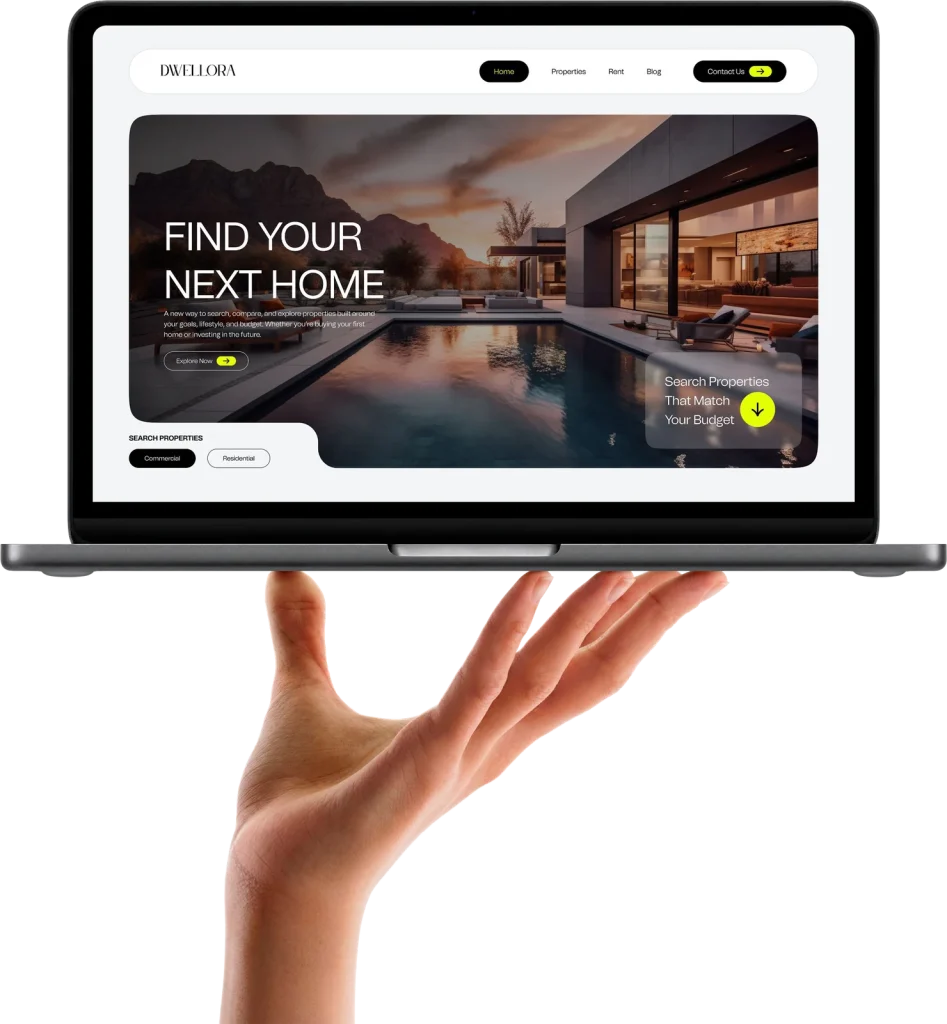 Laptop balanced on a hand showing a website design